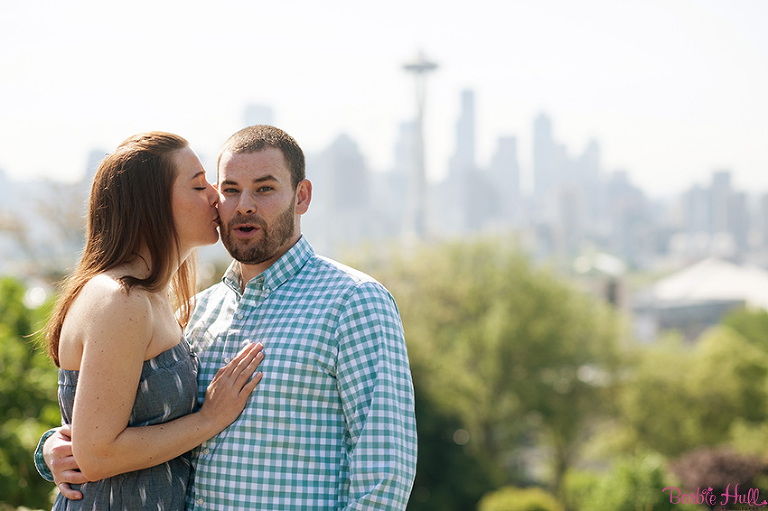 playful engagement portraits with Seattle skyline