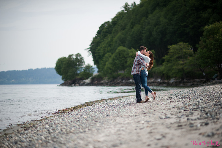 couple kissing on beach in Seattle