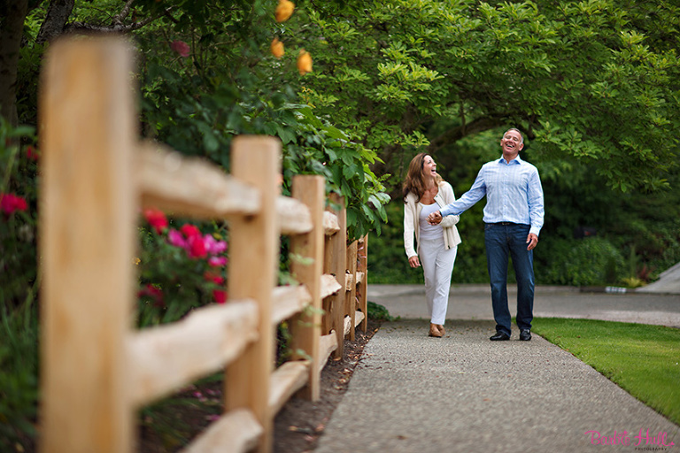 engaged couple laughing in Seattle, WA
