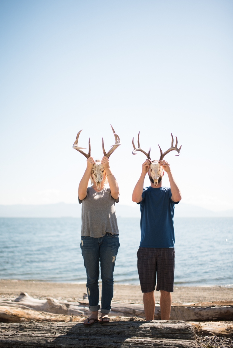Such a goofy bride and groom portrait with their deer head wedding decorations