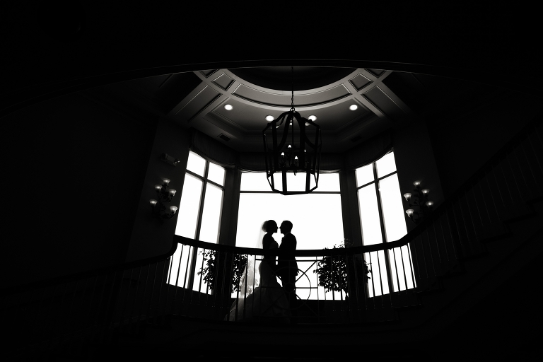 A BEAUTIFUL silhouette of the bride and groom on the staircase at the Woodmark Hotel. 