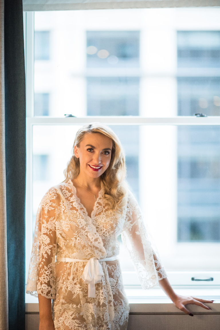 One final quiet moment in the sweetest lace robe before putting on her gown.